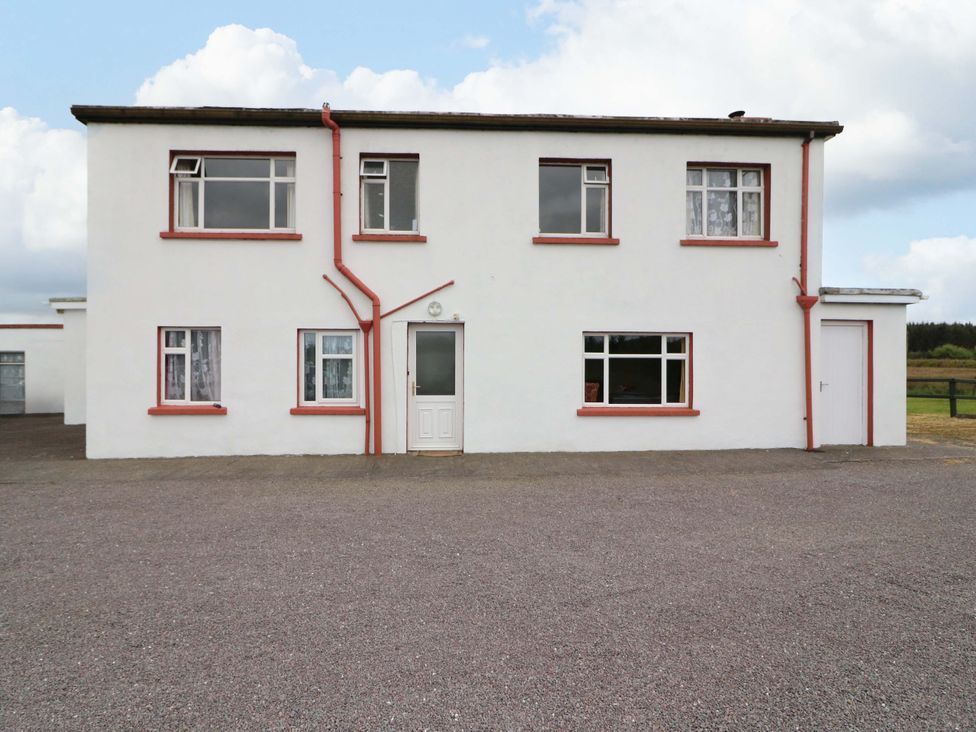 A house facade with multiple windows and a door at Forest View in Ballinskelligs, County Kerry