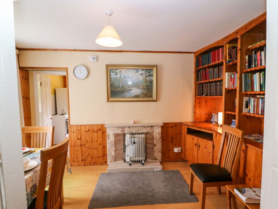 A dining room with a table and chairs at Forest View in Ballinskelligs, County Kerry
