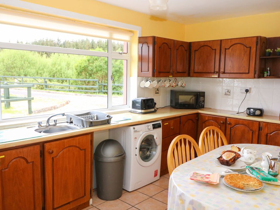 A kitchen with appliances and tableware at Forest View in Ballinskelligs, County Kerry