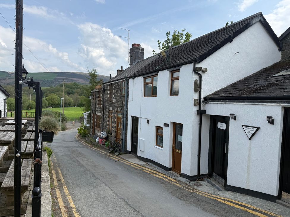 An outdoor view of buildings and road at Triangle Inn Coachouse in Rhayader
