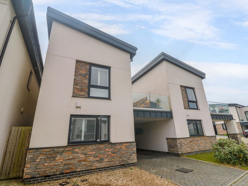 A house with a balcony and driveway at 6 Chapel Rock Close Perranporth