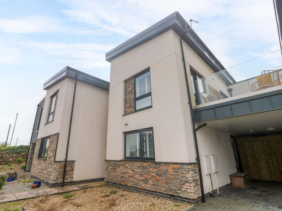 A view of a residential building with a carport at 6 Chapel Rock Close Perranporth