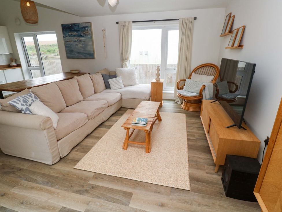 A living room with a sofa and coffee table at 6 Chapel Rock Close in Perranporth