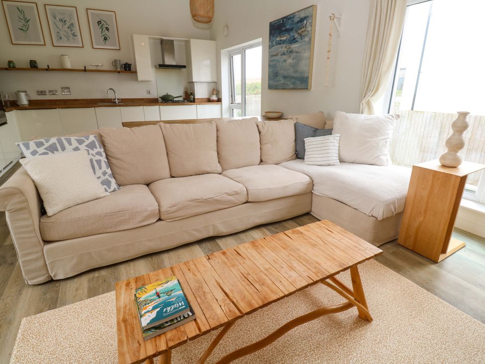 A living room with a sofa and coffee table at 6 Chapel Rock Close Perranporth