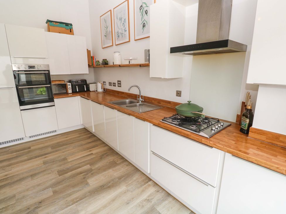 A kitchen with oven, sink, and cooking equipment at 6 Chapel Rock Close Perranporth