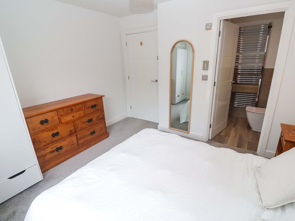 A bedroom with a bed and dresser at 6 Chapel Rock Close Perranporth
