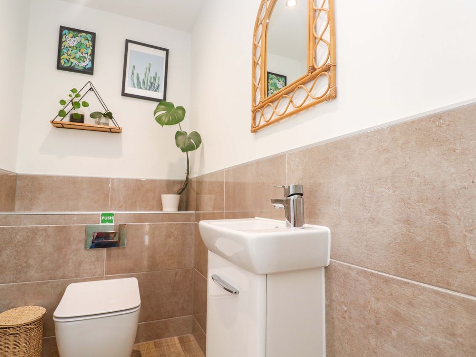 A bathroom with a sink and toilet at 6 Chapel Rock Close in Perranporth