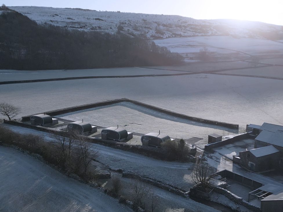 An aerial view of buildings and fields at Little Heaning in Cartmel