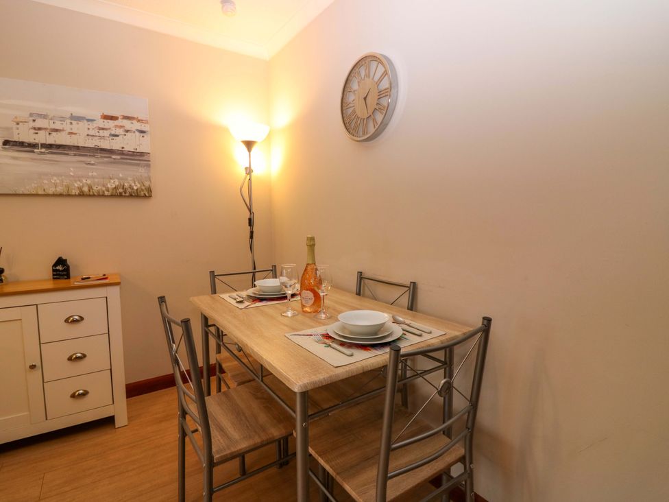 A dining room with a table and chairs at 48 Edenbank Road in Cupar, Fife