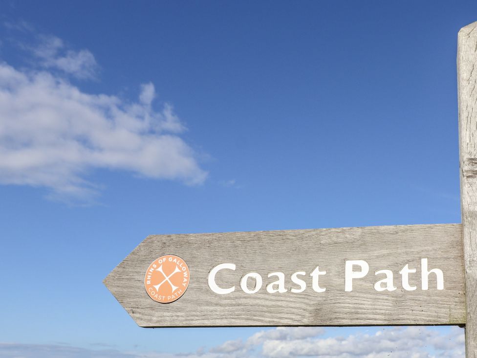 A signpost indicating Coast Path at Kringlands in Kirkcolm