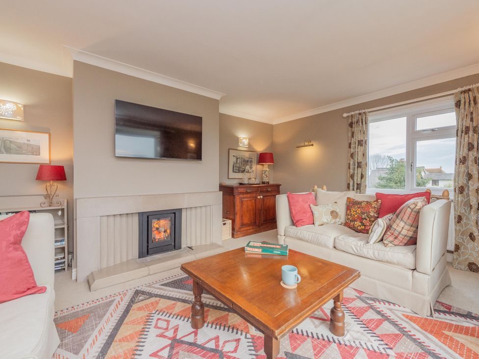 A living room with a television and fireplace at Pear Tree Cottage Church Pulverbatch near Dorrington
