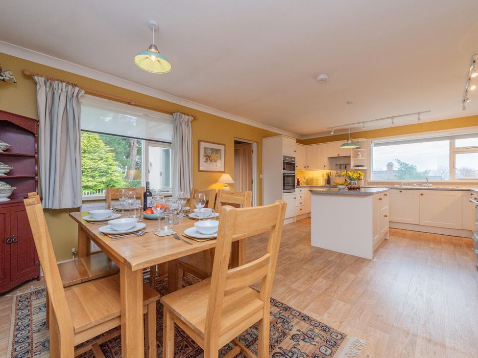 A dining room with a table and chairs at Pear Tree Cottage Church Pulverbatch near Dorrington