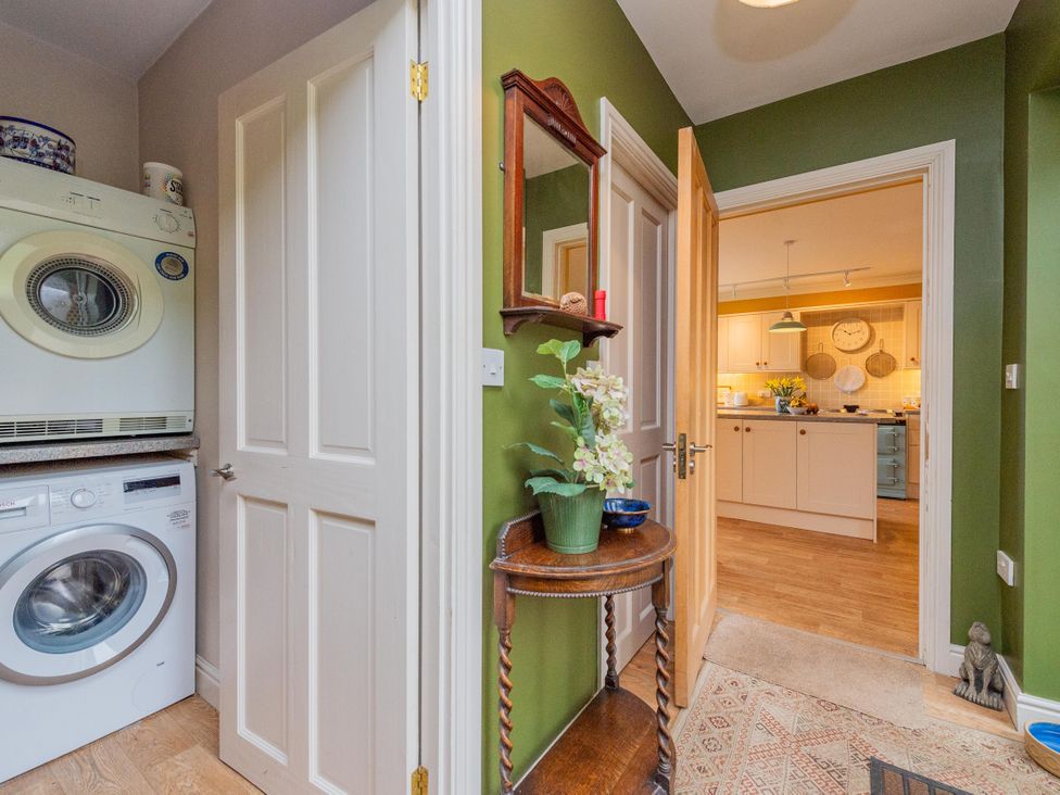 A utility room with a washing machine and dryer at Pear Tree Cottage Church Pulverbatch near Dorrington