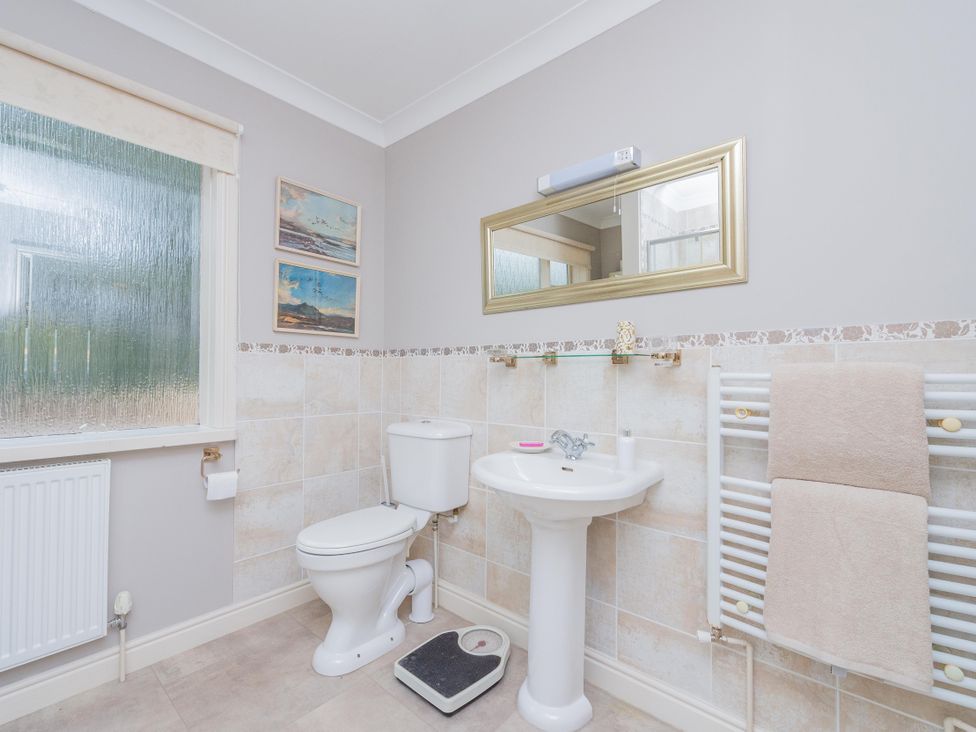 A bathroom with a toilet and sink at Pear Tree Cottage Church Pulverbatch near Dorrington