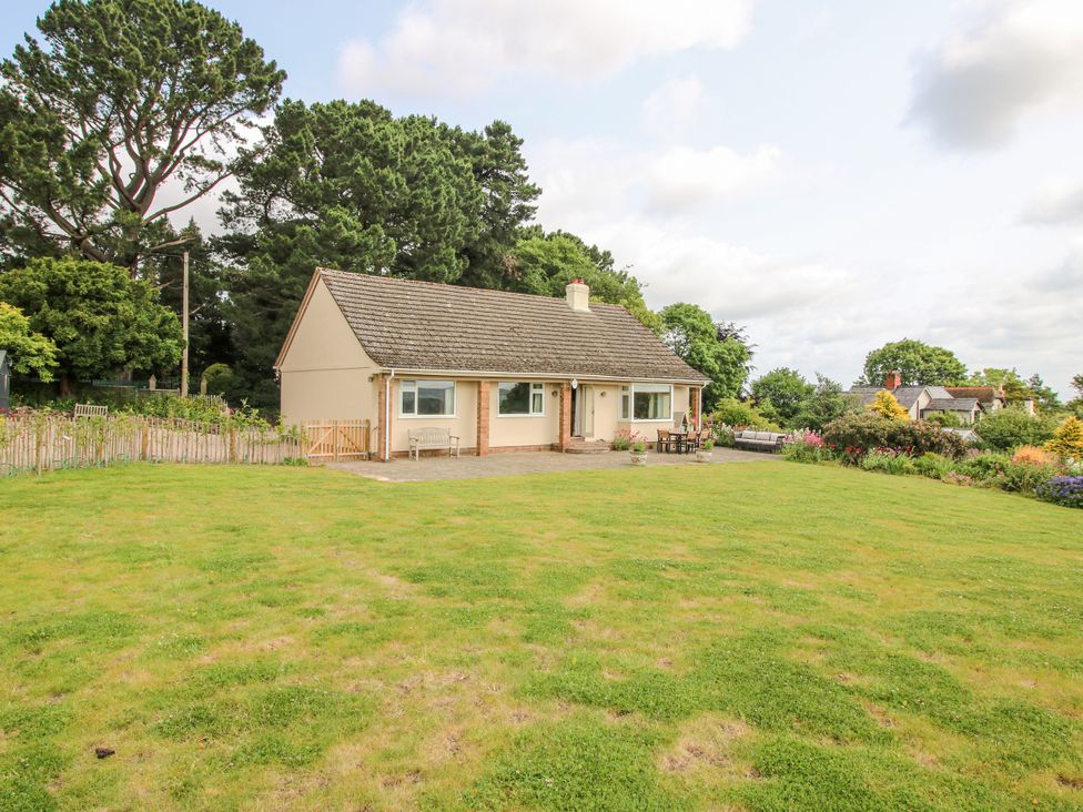 A house with a garden and patio at Pear Tree Cottage in Church Pulverbatch near Dorrington