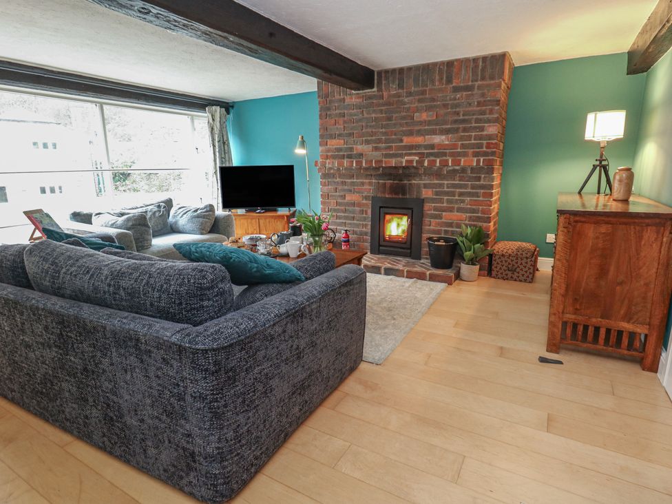 A living room with a sofa and television at The Grain Store in Weymouth