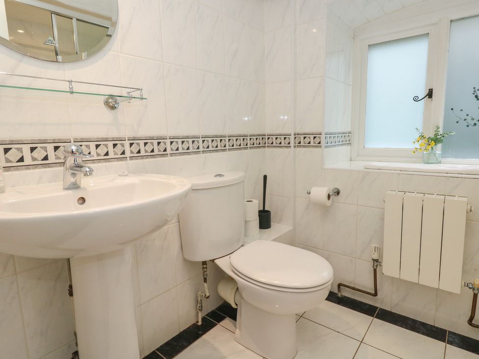 A bathroom with a sink and toilet at The Grain Store in Weymouth