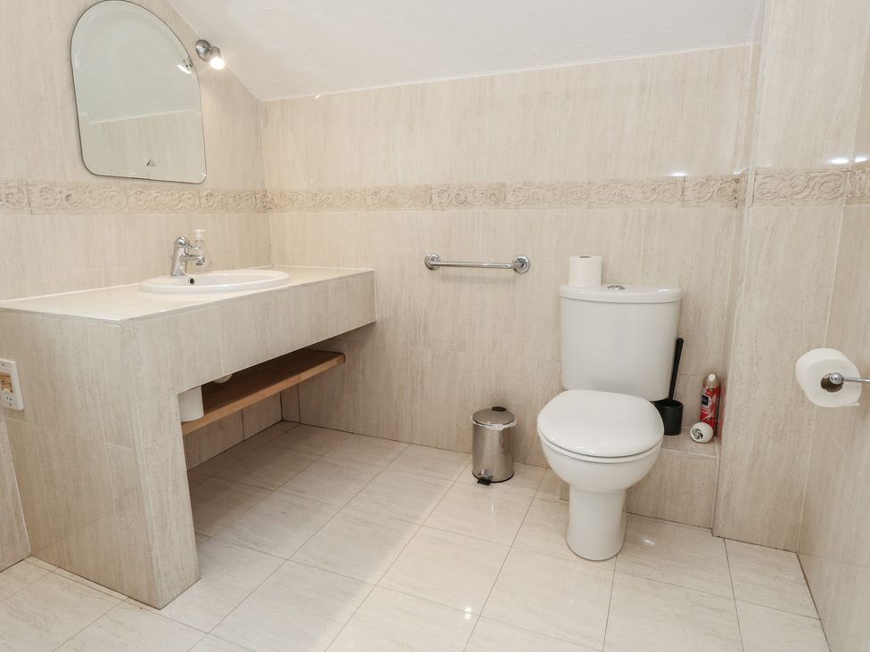 A bathroom with a sink and toilet at The Grain Store in Weymouth