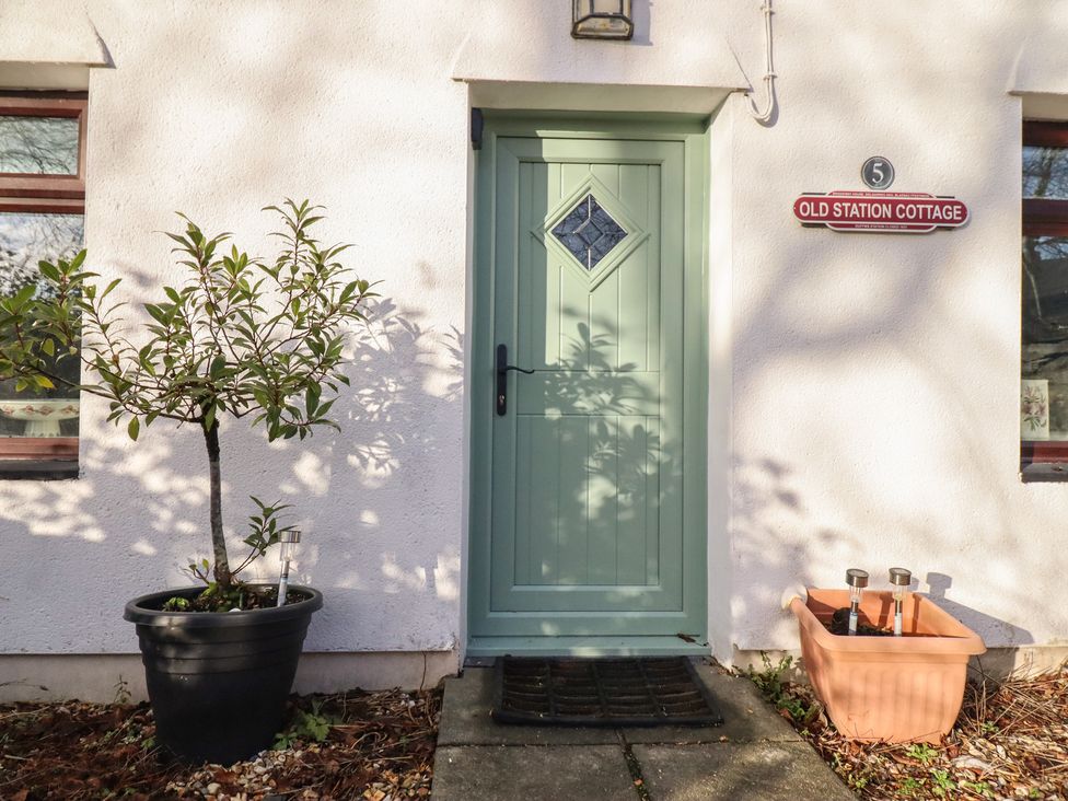 An exterior view of a door and plant at Old Station Cottage in Blaenau Ffestiniog