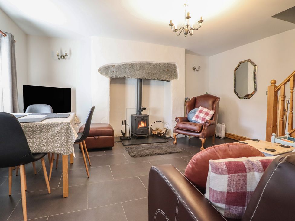 A living room with a fireplace and a television at Bridgeway House in Blaenau Ffestiniog