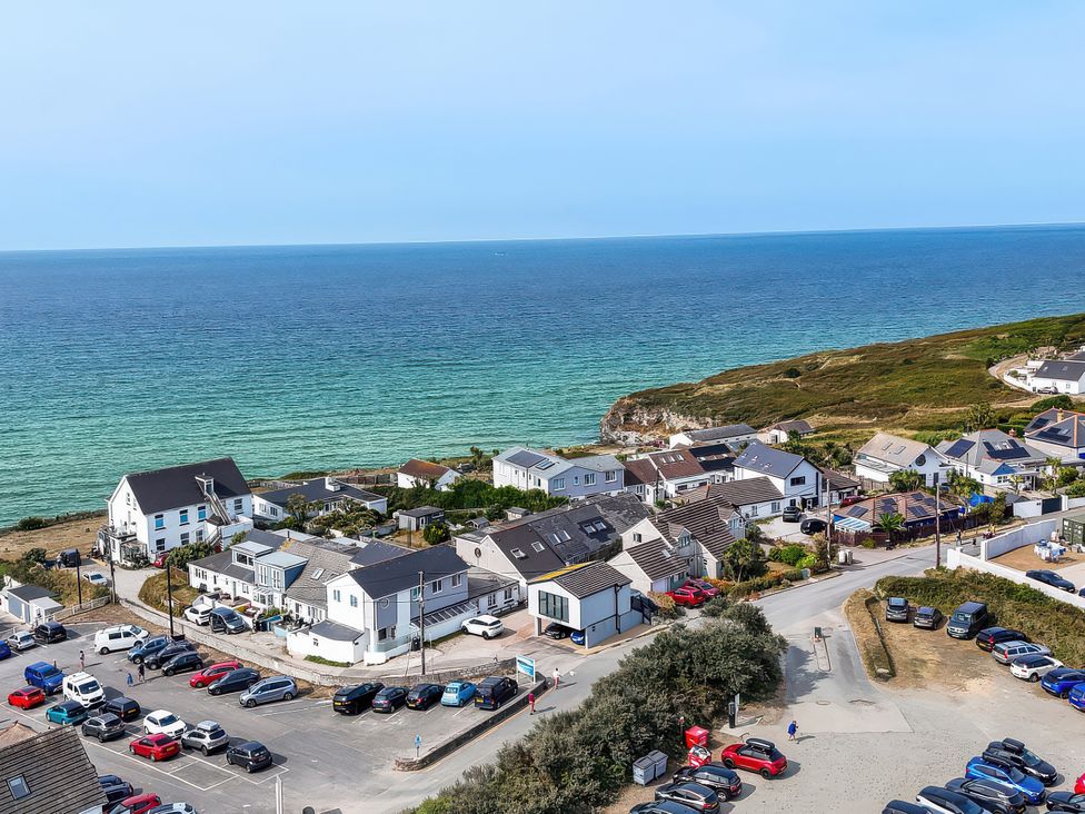 A coastal view with houses and parking at The Sandbox in Hayle