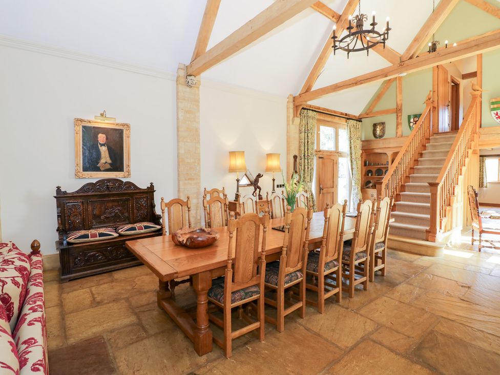 A dining room with a large wooden table and chairs at Rookery Hall in Middle Hill near Broadway