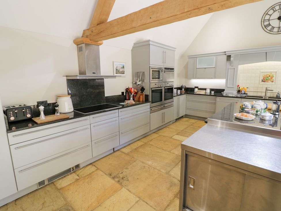 A kitchen with countertops and appliances at Rookery Hall near Middle Hill