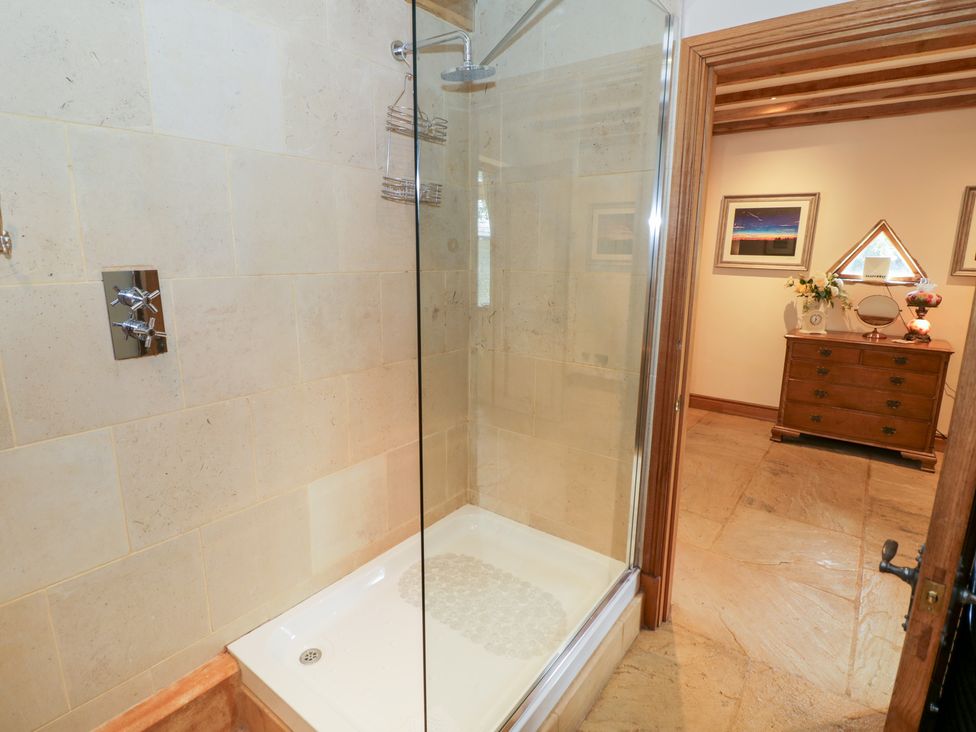 A shower enclosure with glass door in a bathroom at Rookery Hall Middle Hill near Broadway