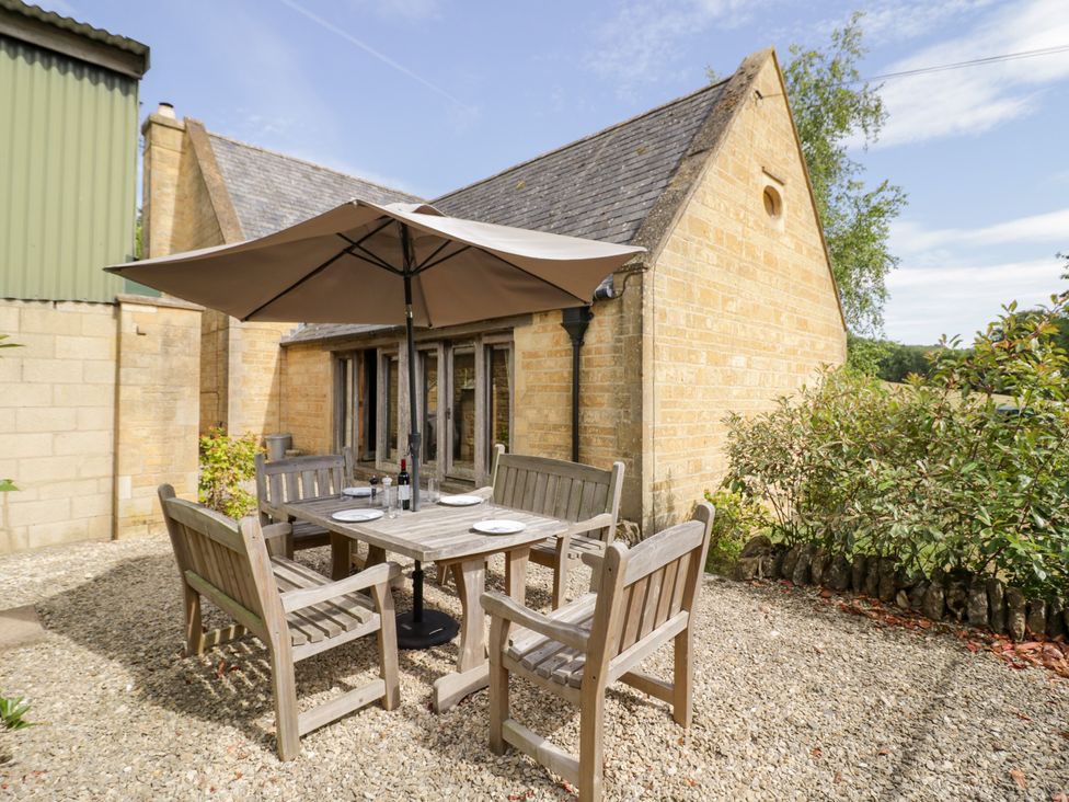 An outdoor dining area with seating at Rookery Hall in Middle Hill near Broadway
