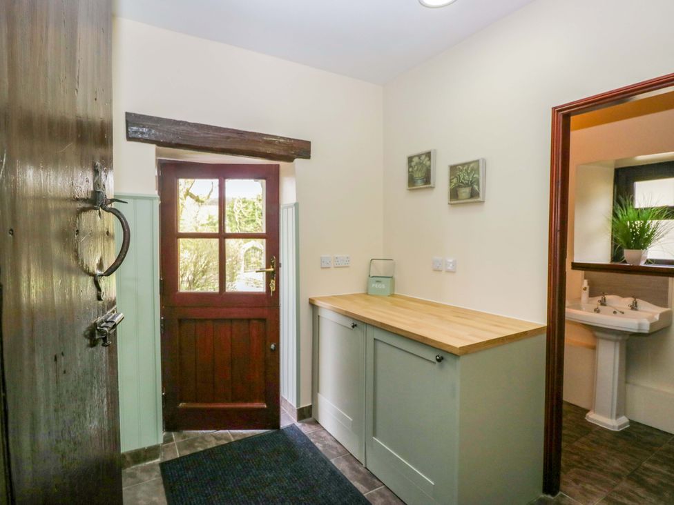 A hallway with a front door and countertop at Ewedale Farm Pennington near Ulverston