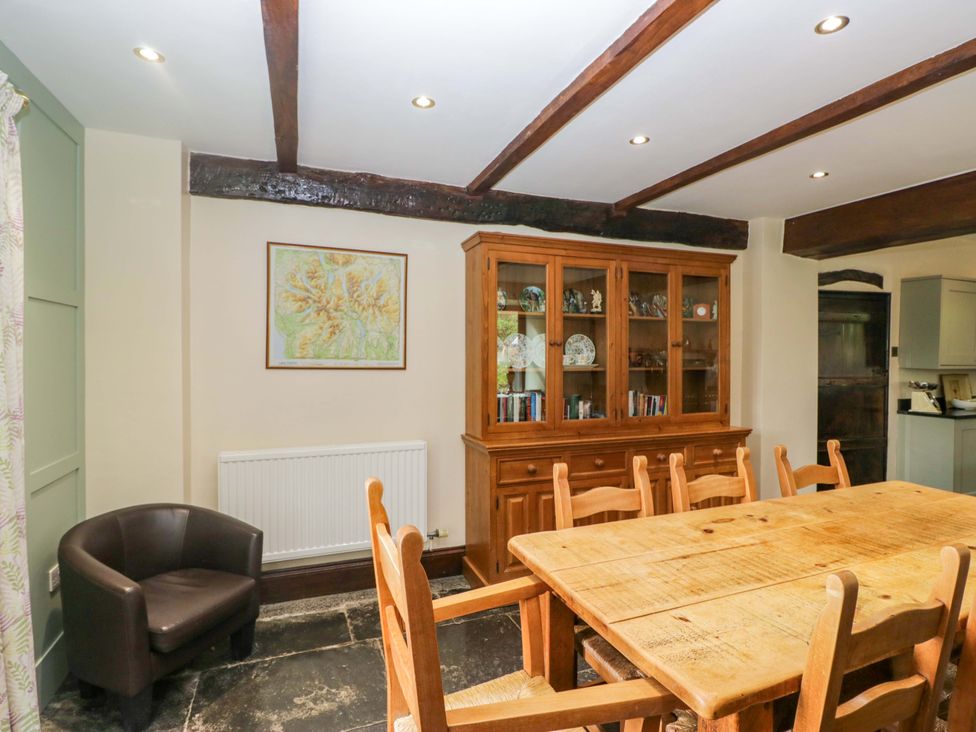 A dining room with a table and chairs at Ewedale Farm in Pennington near Ulverston