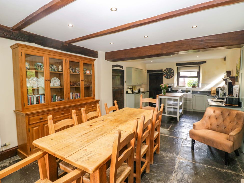 A kitchen with a dining table and sideboard at Ewedale Farm Pennington near Ulverston