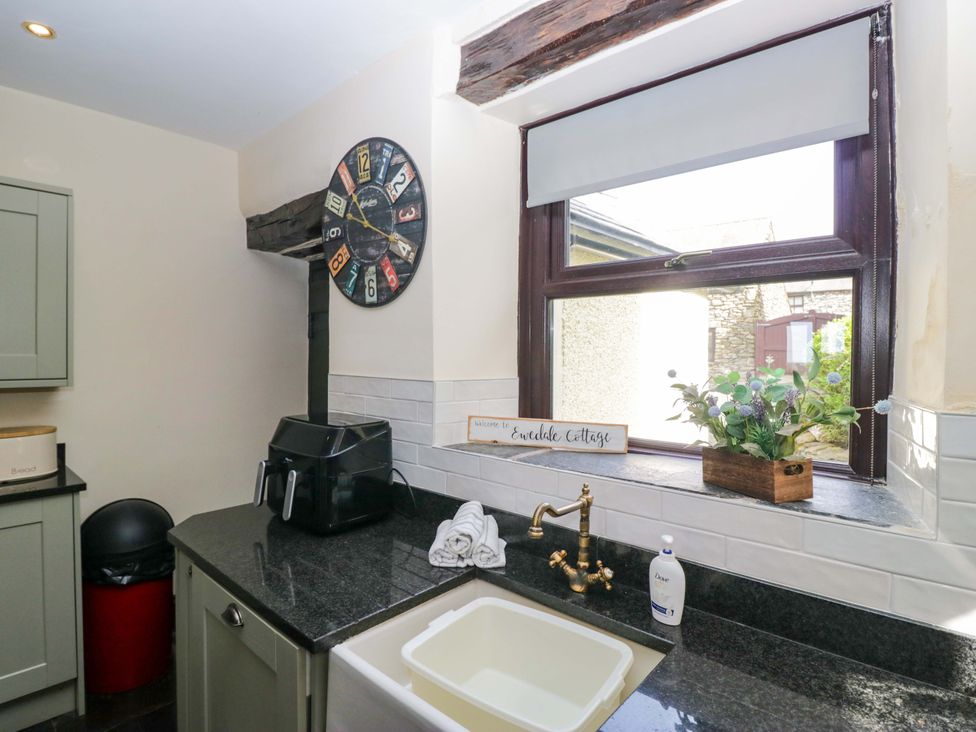 A kitchen with a sink and window at Ewedale Farm in Pennington near Ulverston