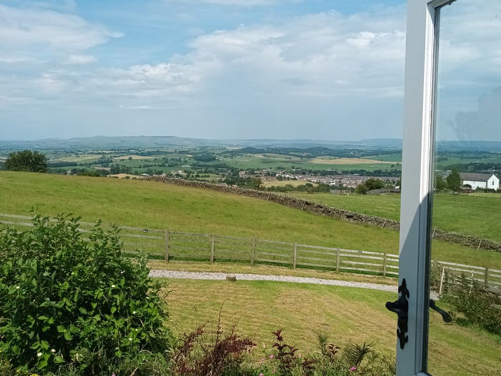 A view of a landscape with hills and fields at The Journeyman Luxury Shepherds Hut in Barnoldswick
