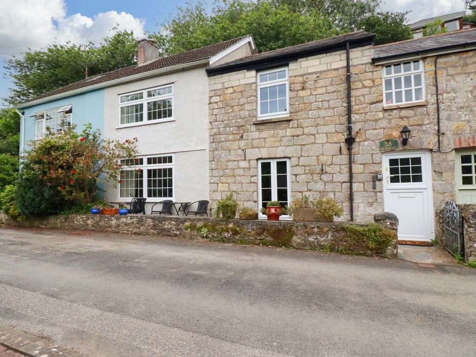 Two houses with windows and door on a street at Vi’s Valley View in Pentewan