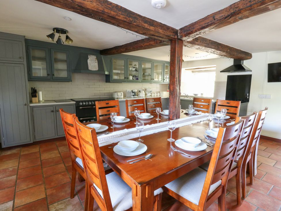 A kitchen with a dining table and chairs at Penarth in Cregrina near Builth Wells