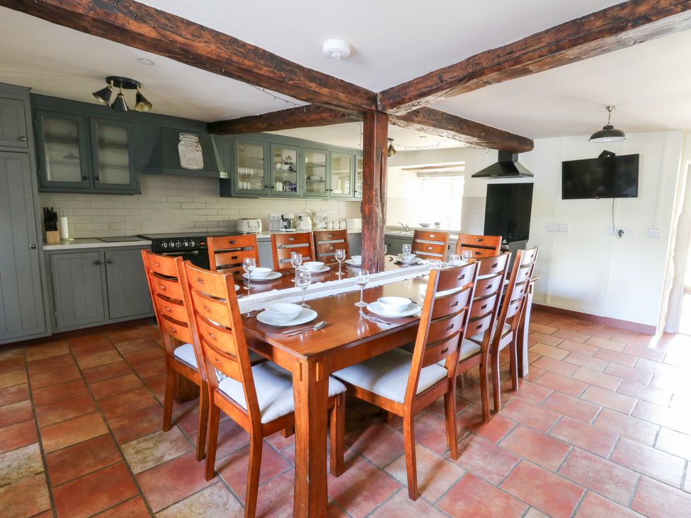 A dining room with a large table and chairs at Penarth Cregrina near Builth Wells