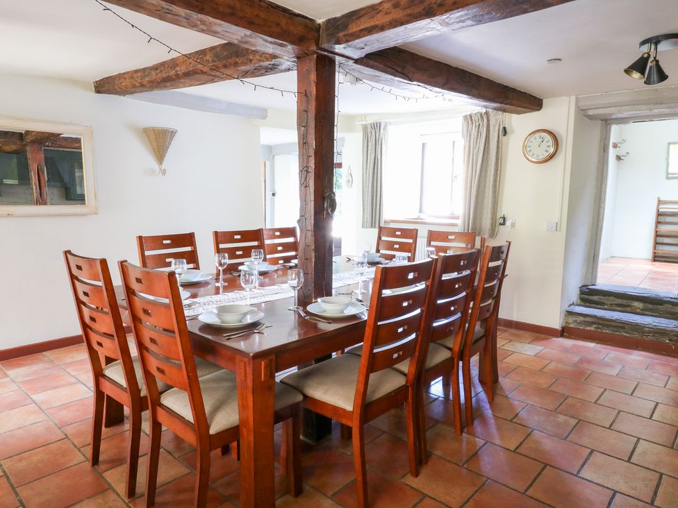 A dining room with a wooden table and chairs at Penarth near Cregrina Builth Wells