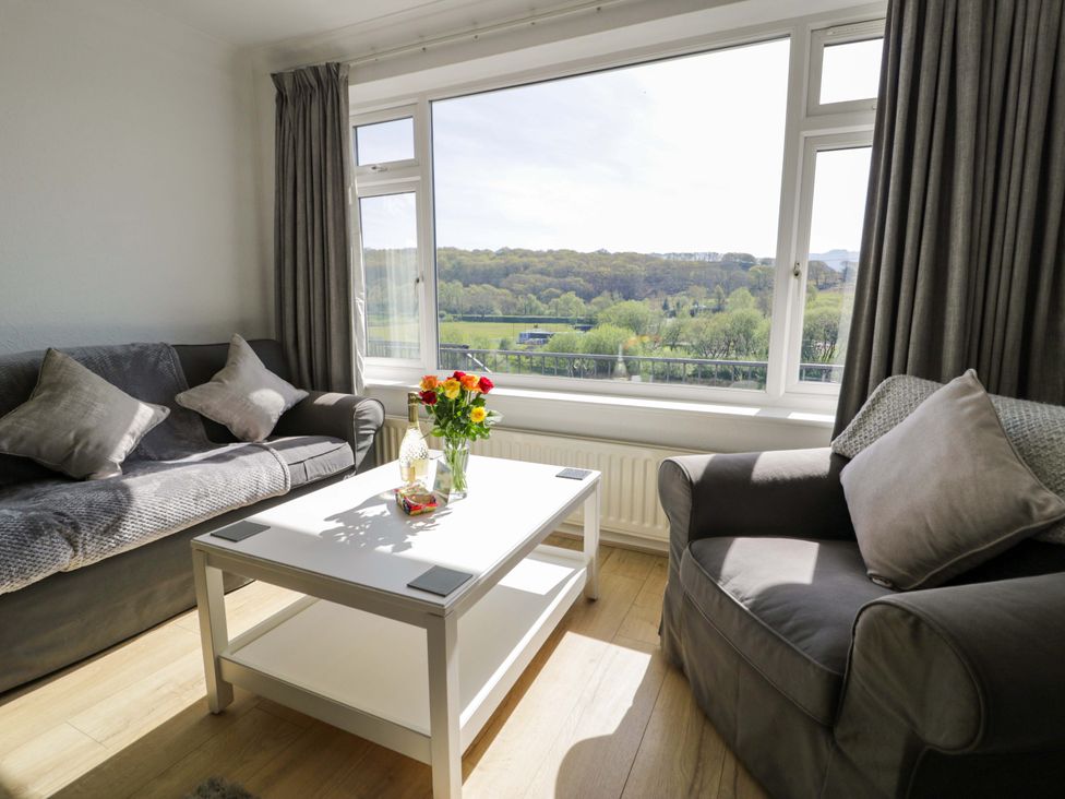 A living room with a sofa and coffee table at Trem Y Foel Penrhyndeudraeth