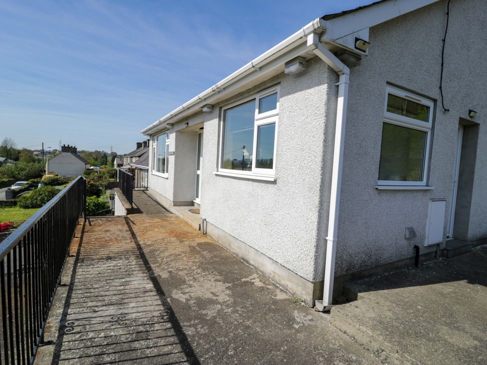 A house exterior with a balcony and pathway at Trem Y Foel Penrhyndeudraeth