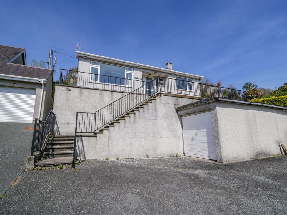 A house with stairs and a garage at Trem Y Foel in Penrhyndeudraeth