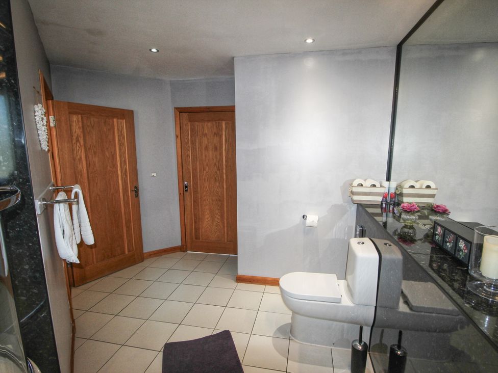 A bathroom with a sink and toilet at Corncrake Cottage in Leverburgh