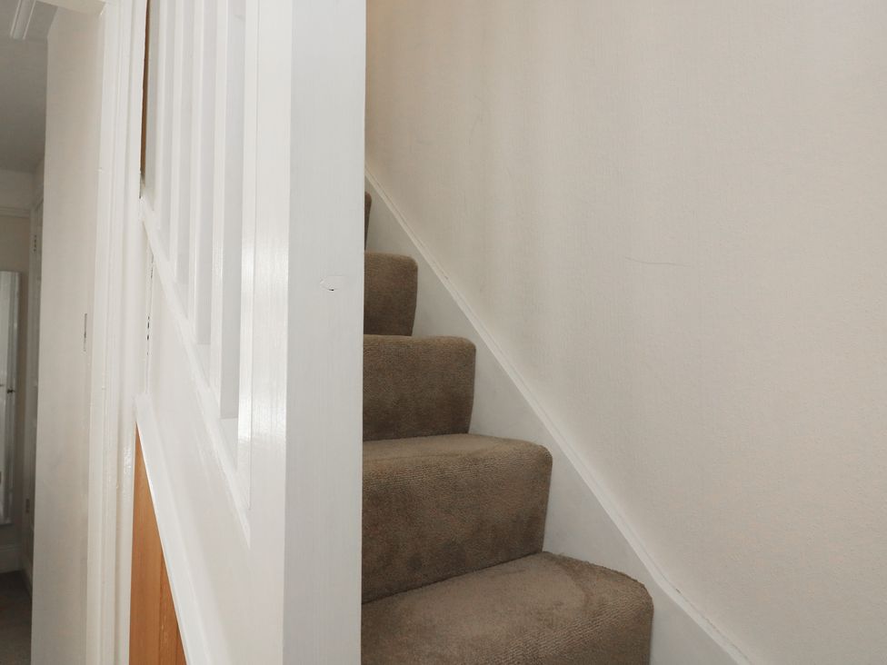 A staircase with carpet at Crew House in Dartmouth