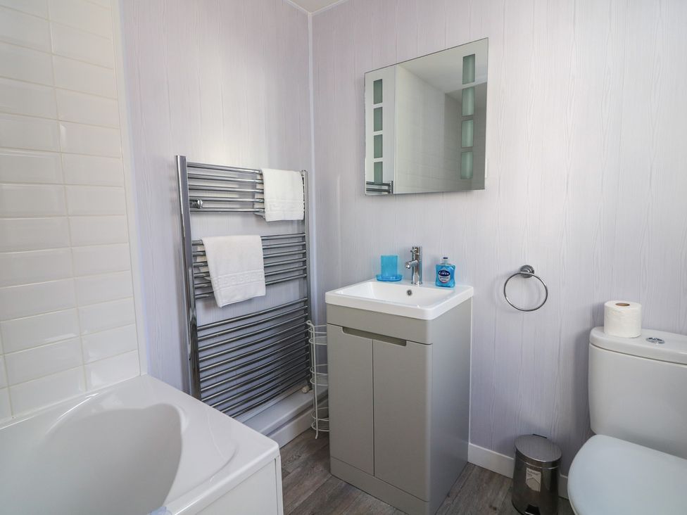 A bathroom with a sink and toilet at Crew House in Dartmouth