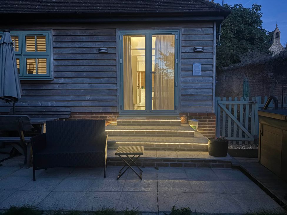 An outdoor area with seating and stairs at Dreamwood Lodge Keston near Leaves Green