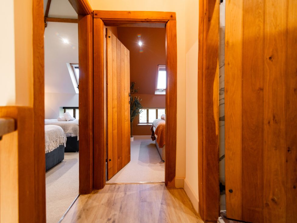 A hallway leading to a bedroom with windows at Dovecote in East Langdon near St Margaret's At Cliffe