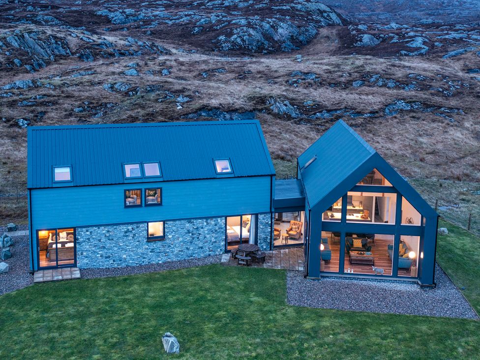 An exterior view of a house with garden at Taigh Rona Luskentyre Isle Of Harris