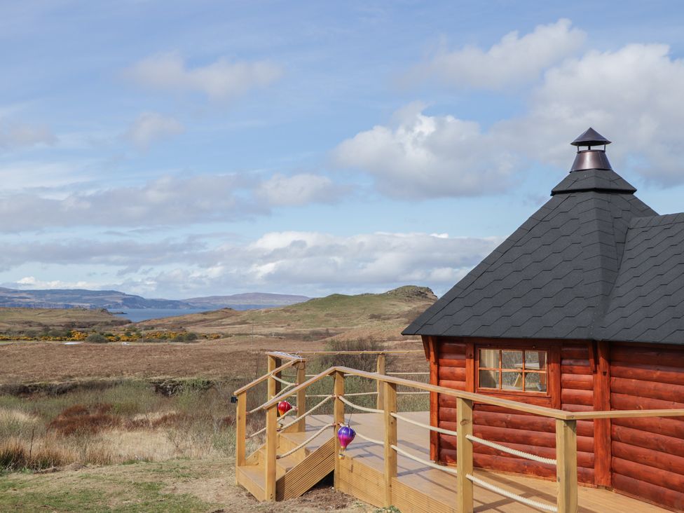 A log cabin exterior with steps at Falls Cottage in Uig