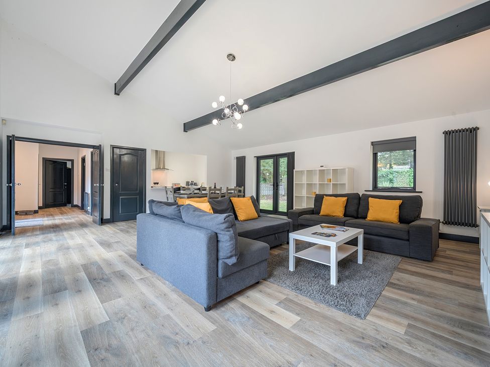 A living room with a sofa and coffee table at The Cottage in Wimborne Minster
