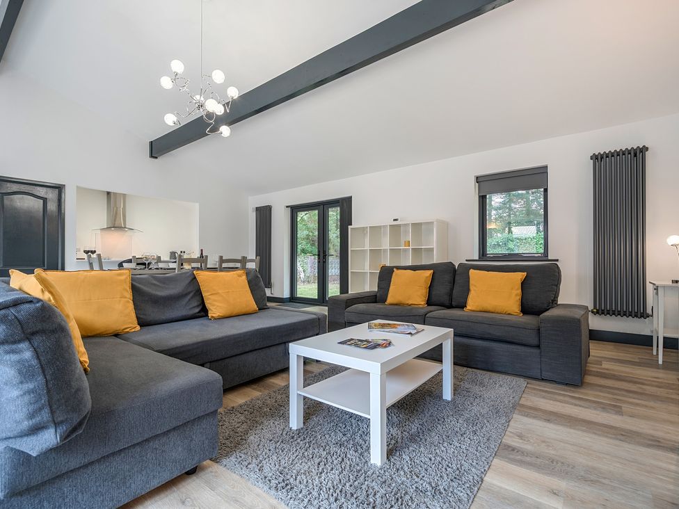 A living room with sofas and a coffee table at The Cottage in Wimborne Minster